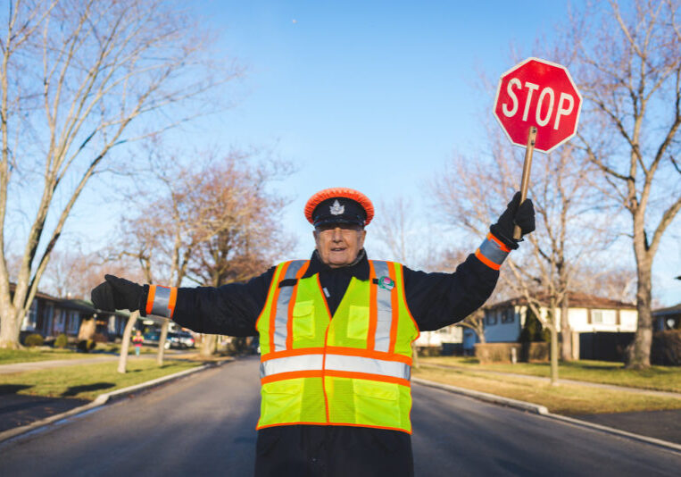 limit form submissions featured image- English crossing guard holding up stop sign in road