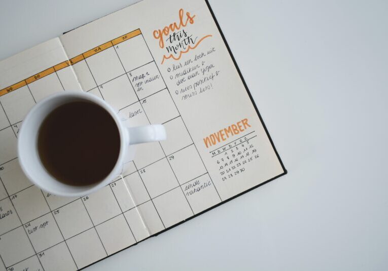 November calendar with a cup of coffee