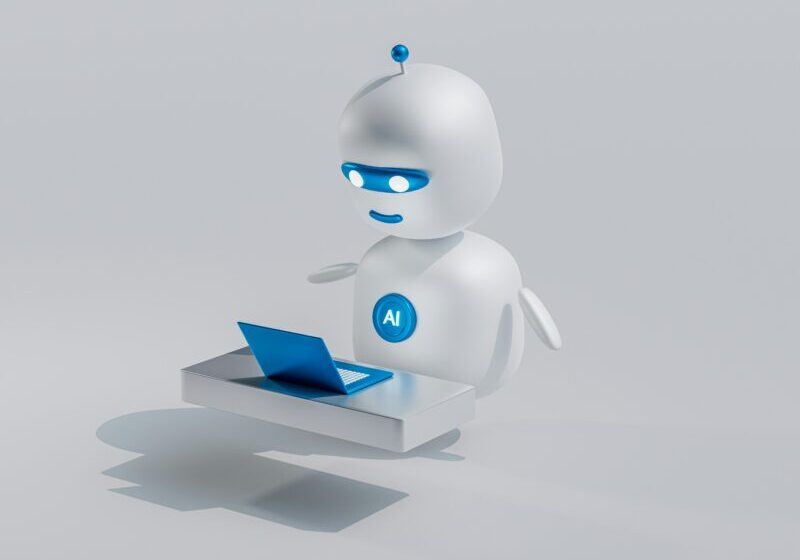 Robot looking at a laptop